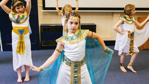Children performing play dressed up as Egyptians